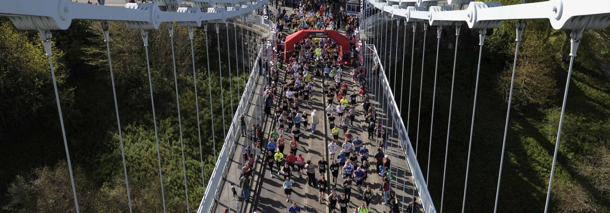 Birds-eye view of the Anglesey Half Marathon startline on the Menai Suspension Bridge, North Wales