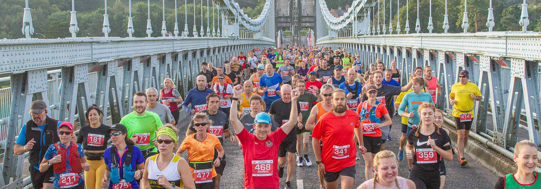 Runners on North Wales' Menai Suspension Bridge in the Anglesey Half Marathon & 10k