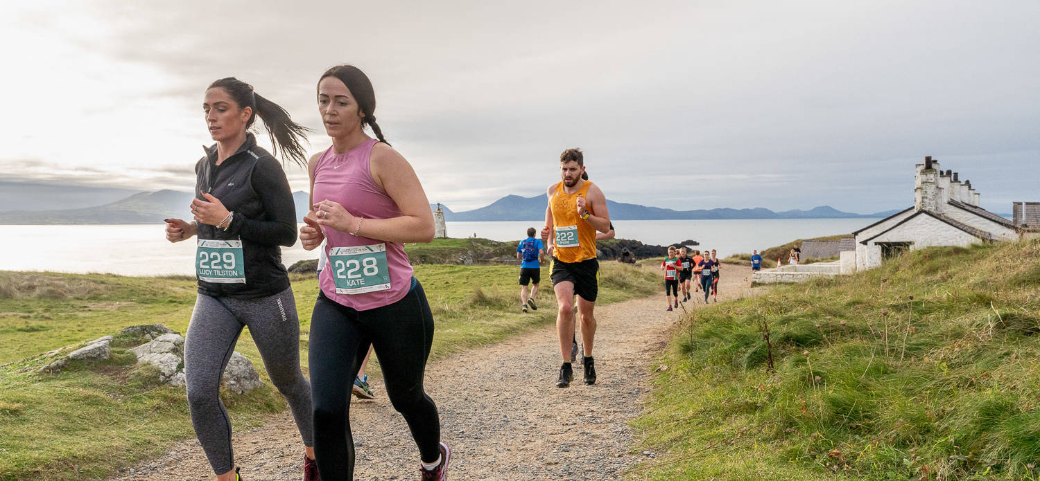 Runners on Ynys Llanddwyn Island