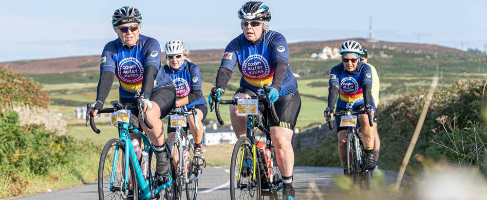 Brightly coloured riders in the Tour de Mon Anglesey Cycle Sportive bike ride event