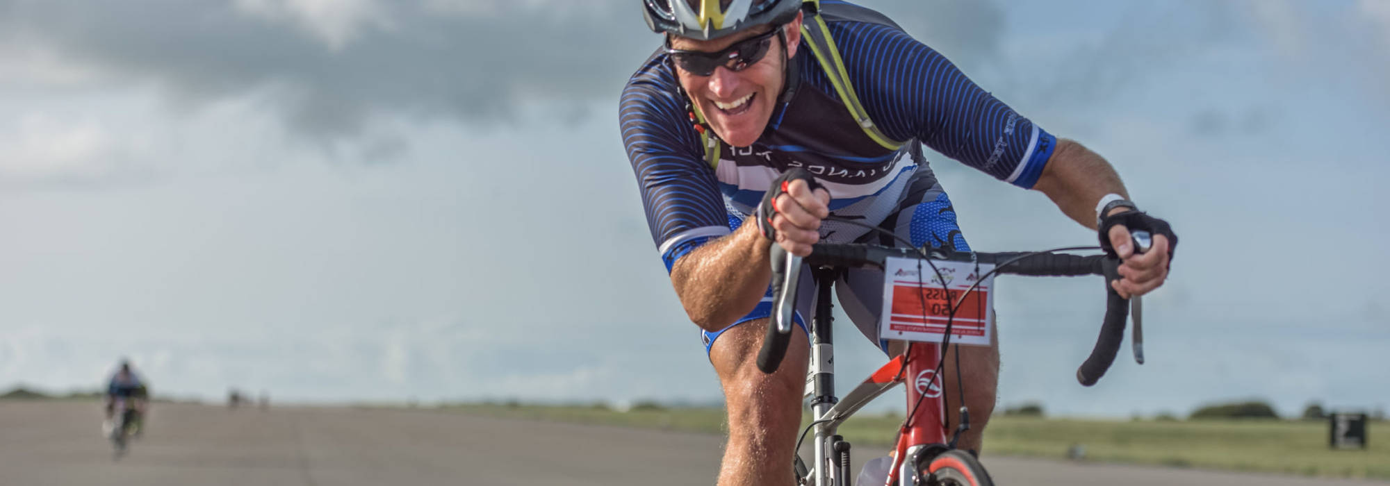 Rider on the RAF Valley runway in the Tour de Mon's Flying Mile, Anglesey bike ride event